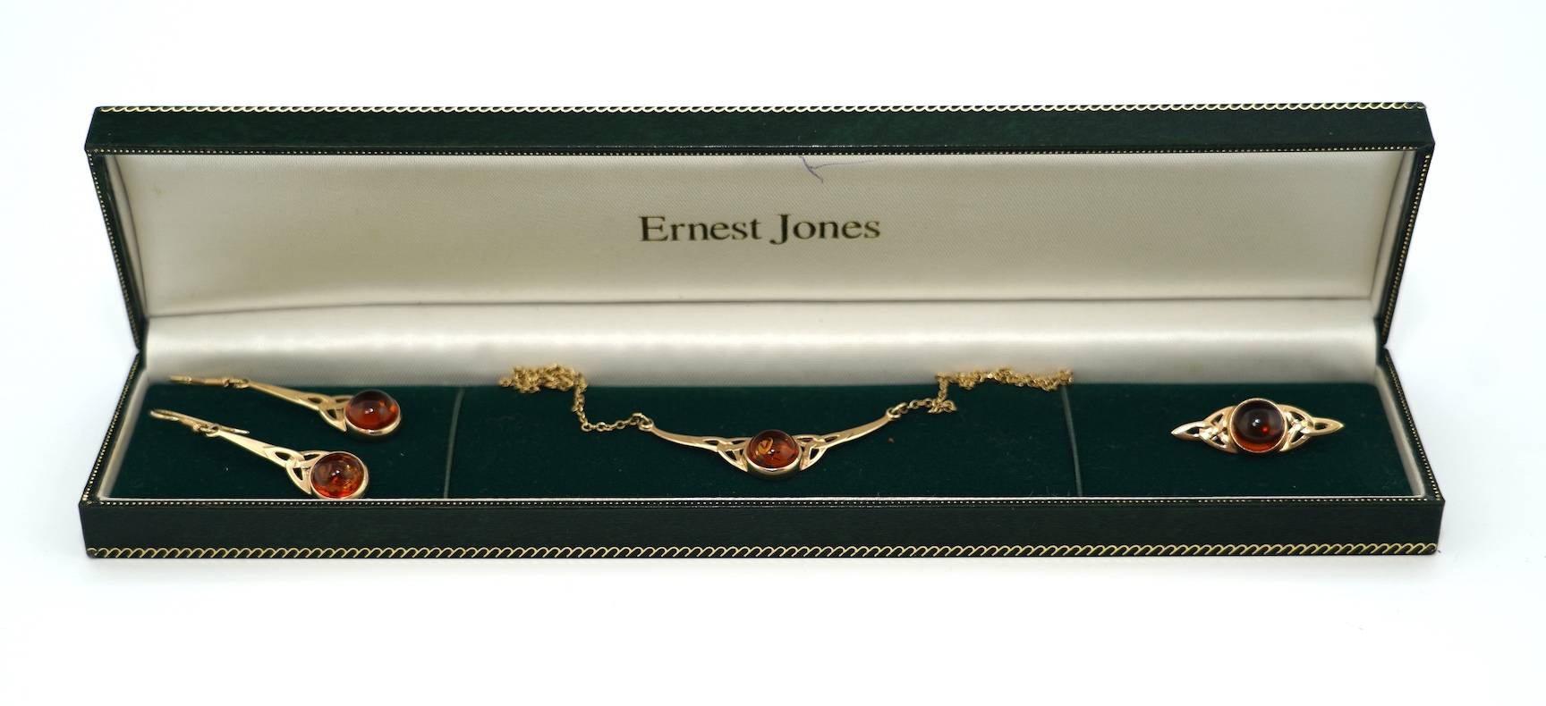 A modern suite of 9ct gold and amber set jewellery, comprising a necklace, 38cm, brooch and pair of drop earrings, gross weight 11.2 grams. Condition - good